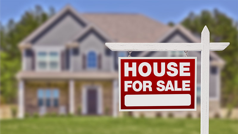 Home For Sale Real Estate Sign seen before scheduling home inspection services