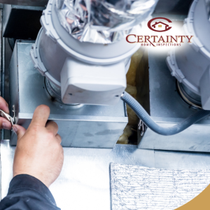 HVAC technician performing maintenance on air duct system in a residential setting.