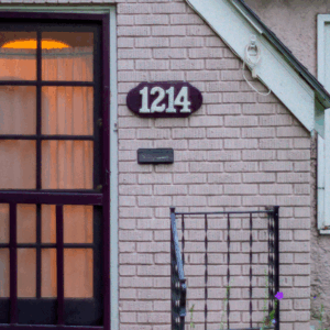 House number 1214 on a plaque above the front door of a brick house