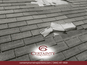 Roof shingles with visible damage and patches.