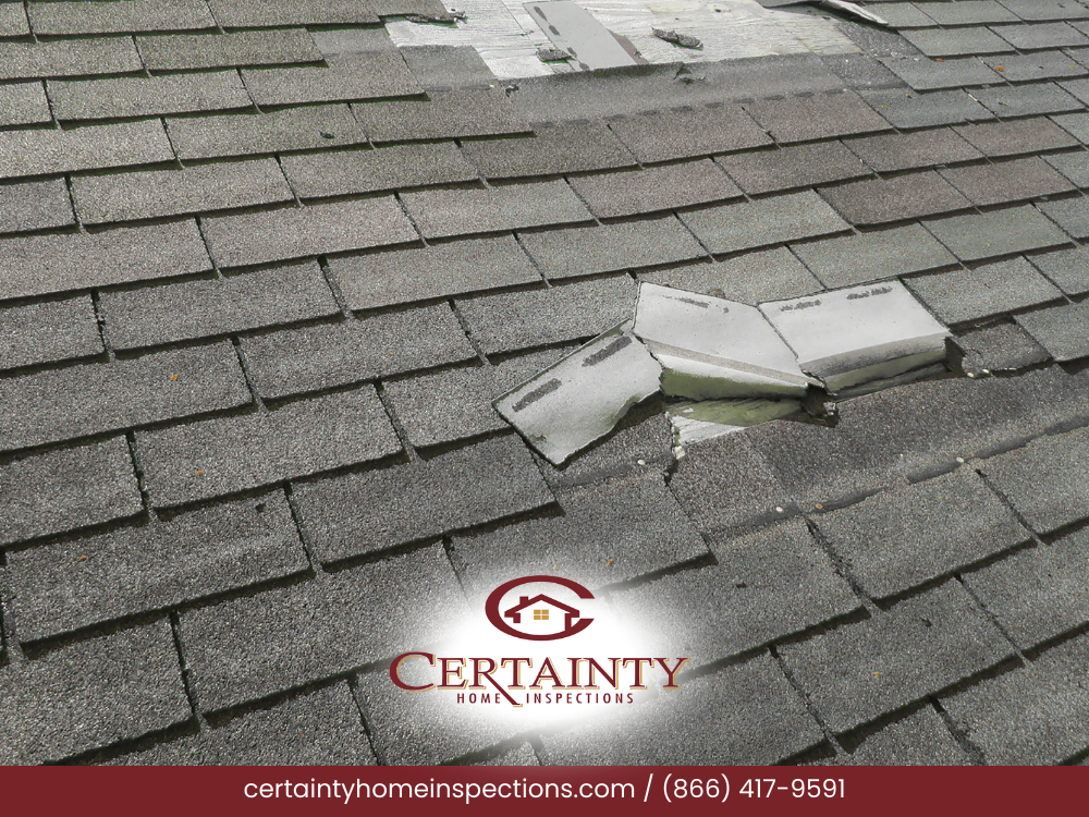 Roof shingles with visible damage and patches.